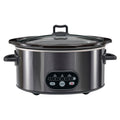 A stainless steel slow cooker with a black control panel, black handles, and a clear glass lid, shown against a plain white background.