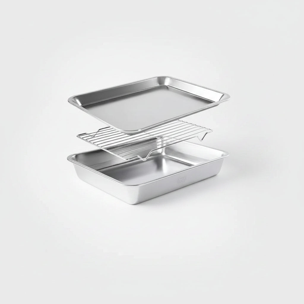 A three-piece stainless steel baking set consisting of a rectangular baking pan, a wire cooling rack, and a larger rectangular baking pan, displayed on a clean light gray background.