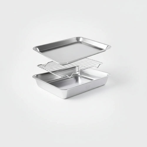 A three-piece stainless steel baking set consisting of a rectangular baking pan, a wire cooling rack, and a larger rectangular baking pan, displayed on a clean light gray background.