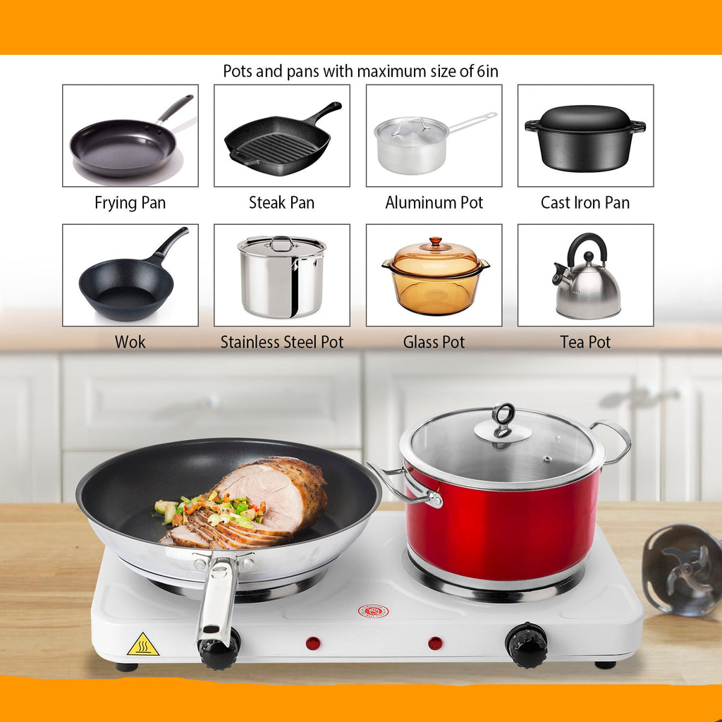 Hot plate with pots and pans on a wooden surface, showing compatibility with various cookware.