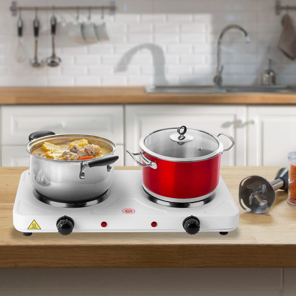 Double hot plate with pots on a kitchen counter