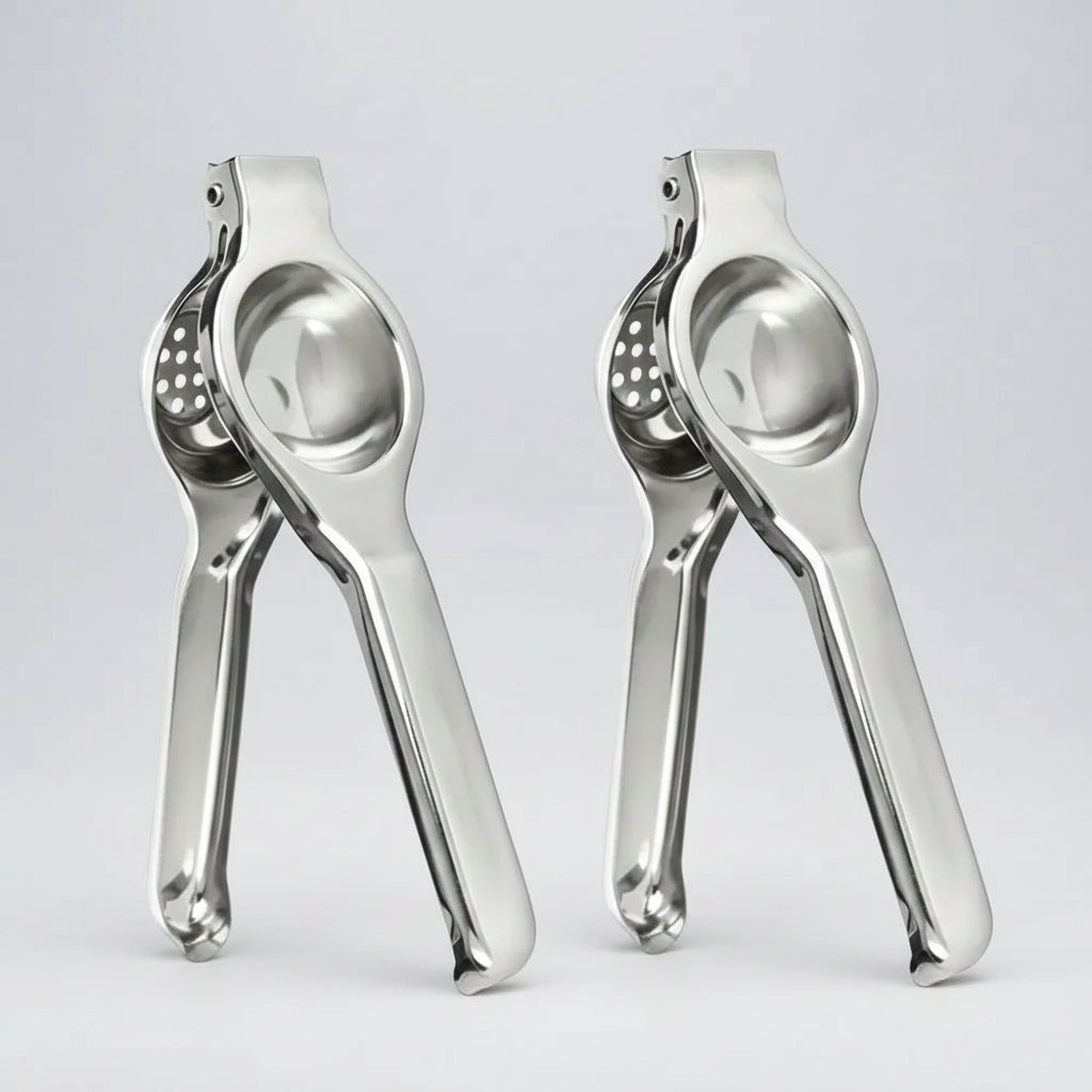 Two metal garlic presses on a white background