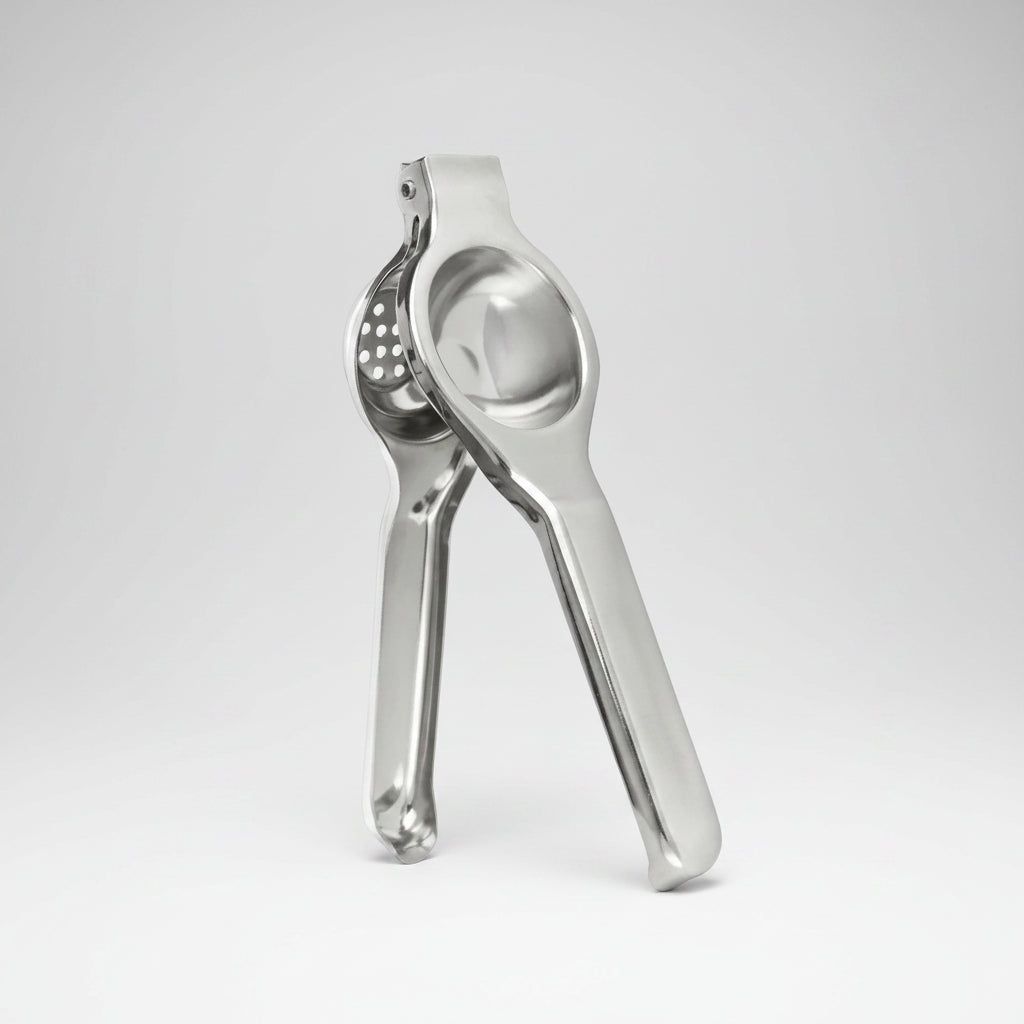 Metallic kitchen press on a white background