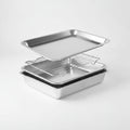 Set of three stainless steel baking pans on a white background