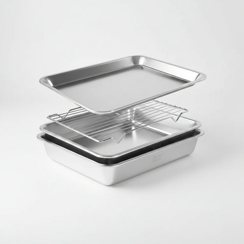 Set of three stainless steel baking pans on a white background